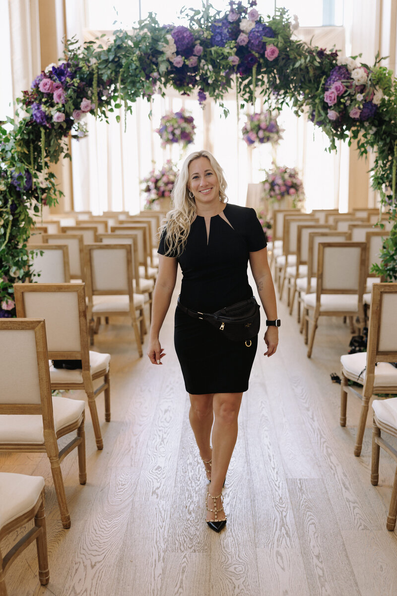 Florida wedding planner Amber wearing a white cape suit