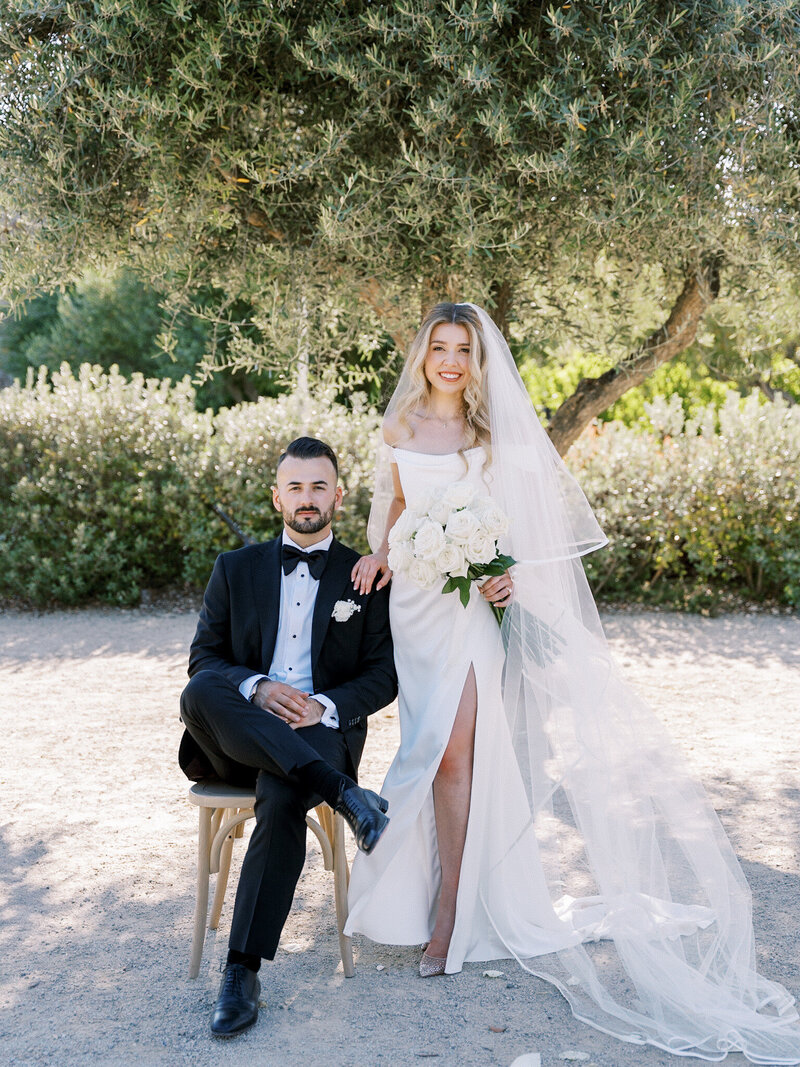  A bride holds a carousel over herself during her wedding at the Santa Barbara zoo.