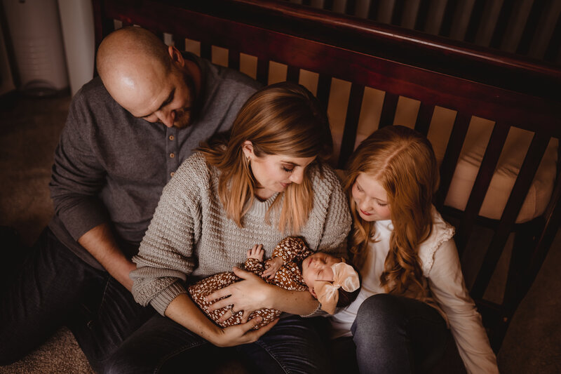 FAMILY SESSION IN NURSERY BY CRIB