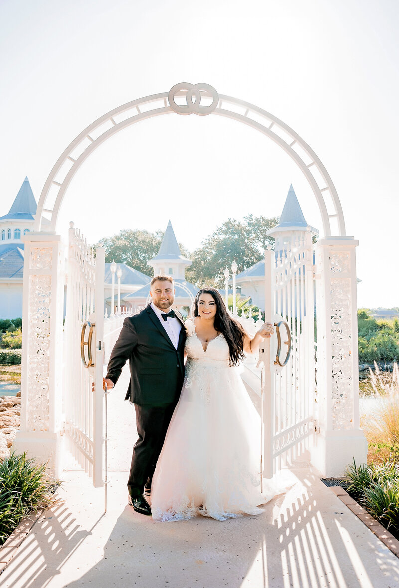 wedding couple pose at entrance to Orlando wedding venue
