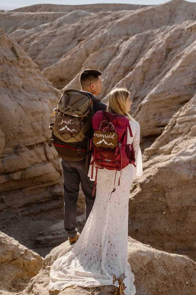 LGBTQ Couple embracing on a cliff in Anza-Borrego