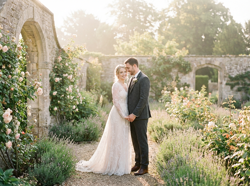 Firefly_Gemini Flash_Fine-art film portrait of a bride and groom standing together in a sunlit European wa 90934