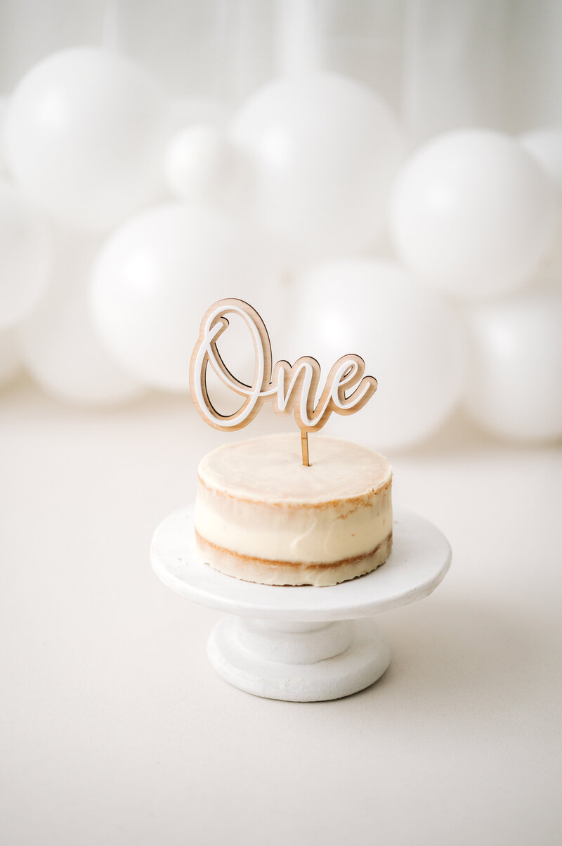 A semi-naked cake being used in a cake smash photoshoot in Billingshurst