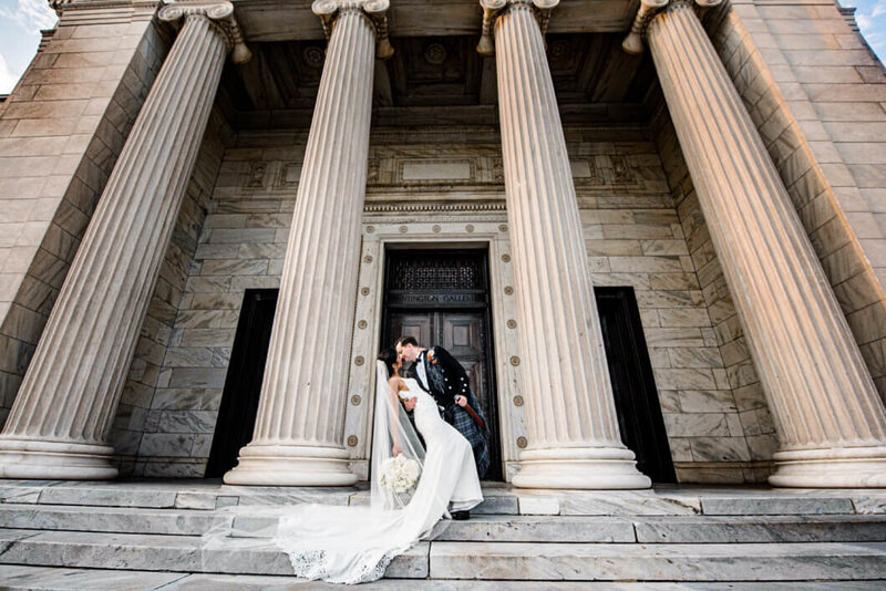 bride and groom on the steps of the art museum in cleveland wedding photography captured by three and eight