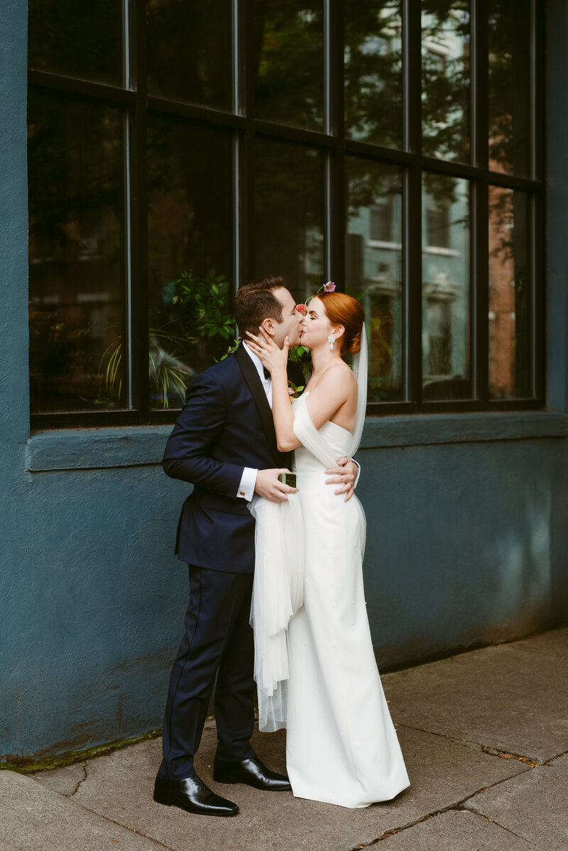 Couple kissing at their wedding, by Ohio wedding planner Love & Whimsy Events