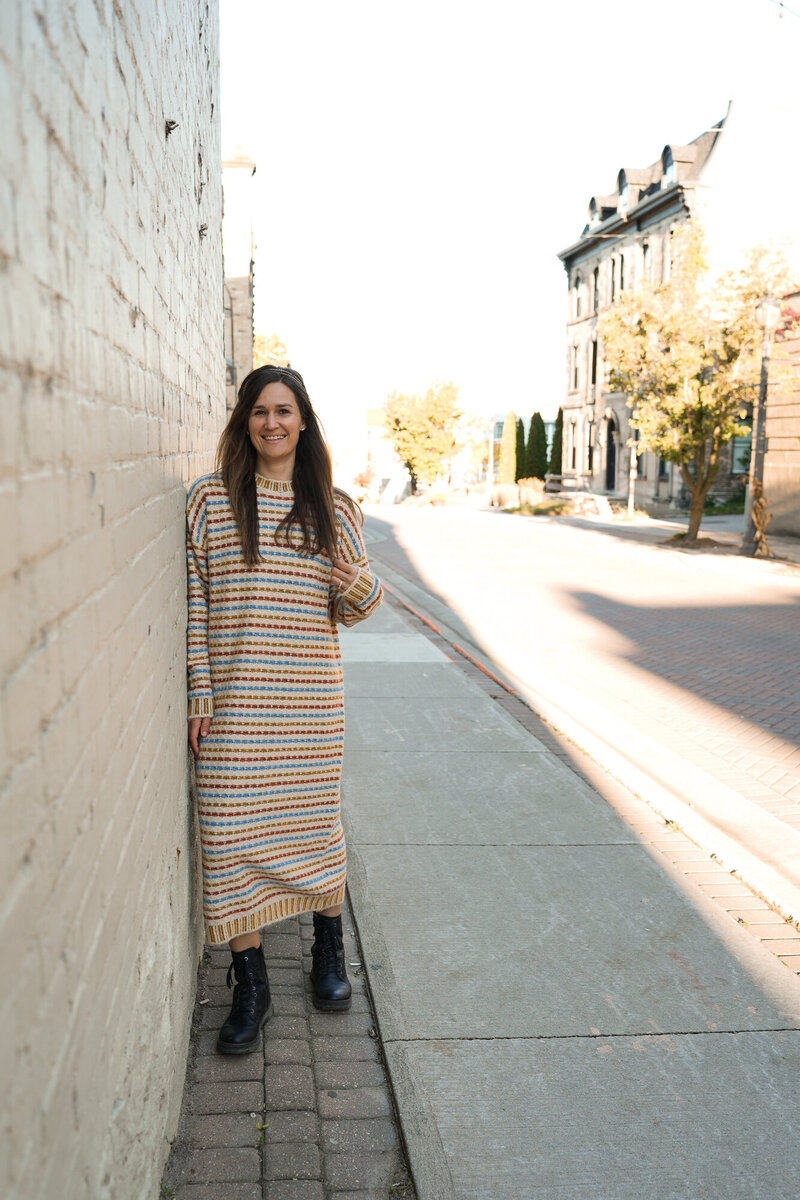 Jasmin smiling in a pink shirt