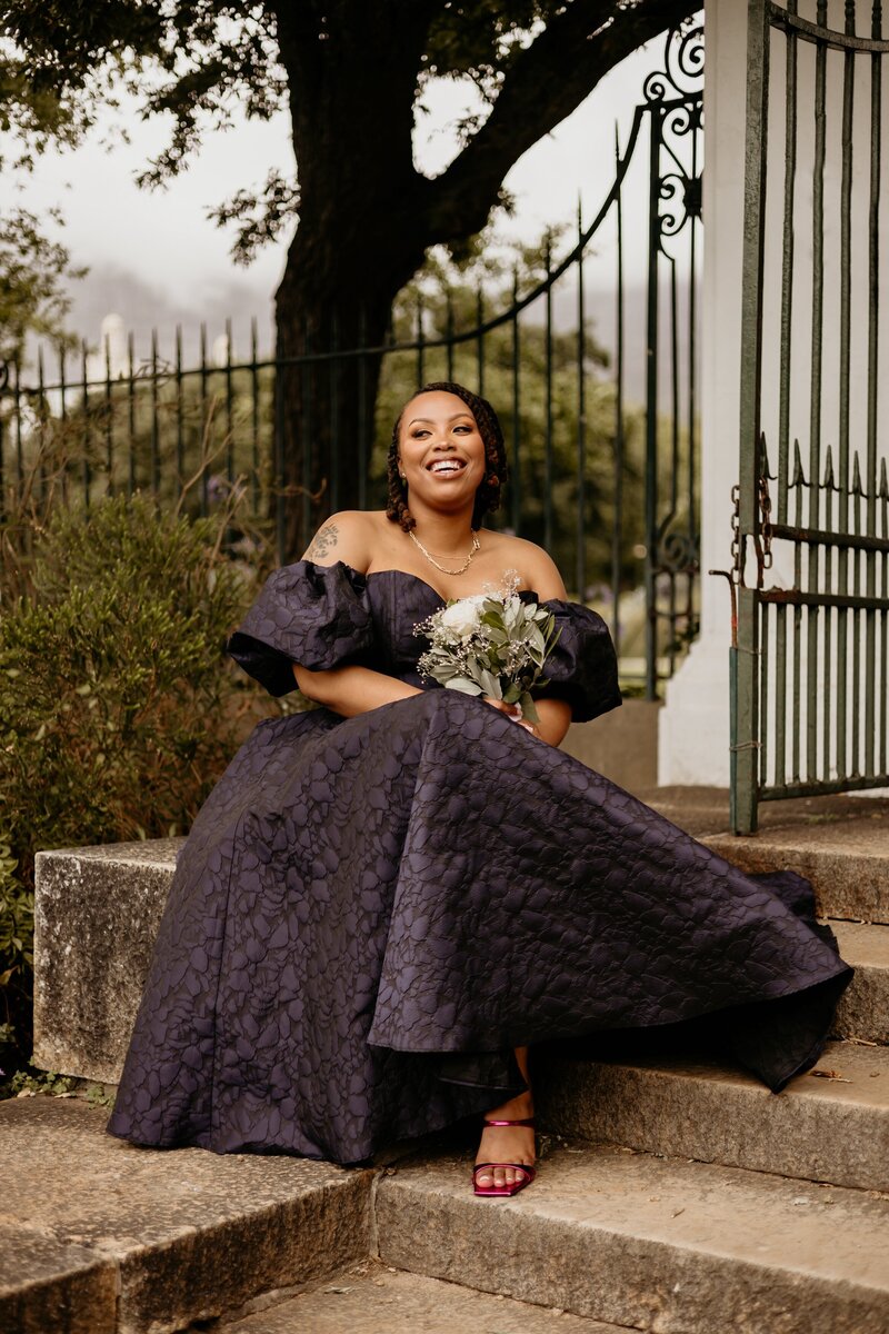 Beautiful South African bride sitting in Company's Garden