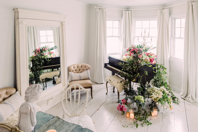 White vintage Parisian-style room with cascading flowers on piano – Wheaton IL interiors