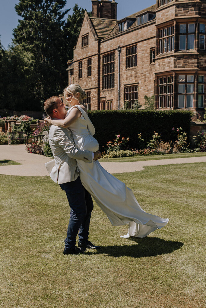 Newlyweds dancing outside Salt House surrounded by summer light and laughter