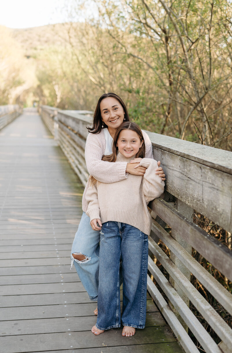 mom and daughter on bridge at Muir beach photo session with a photographer in Mill Valley, Marin County 