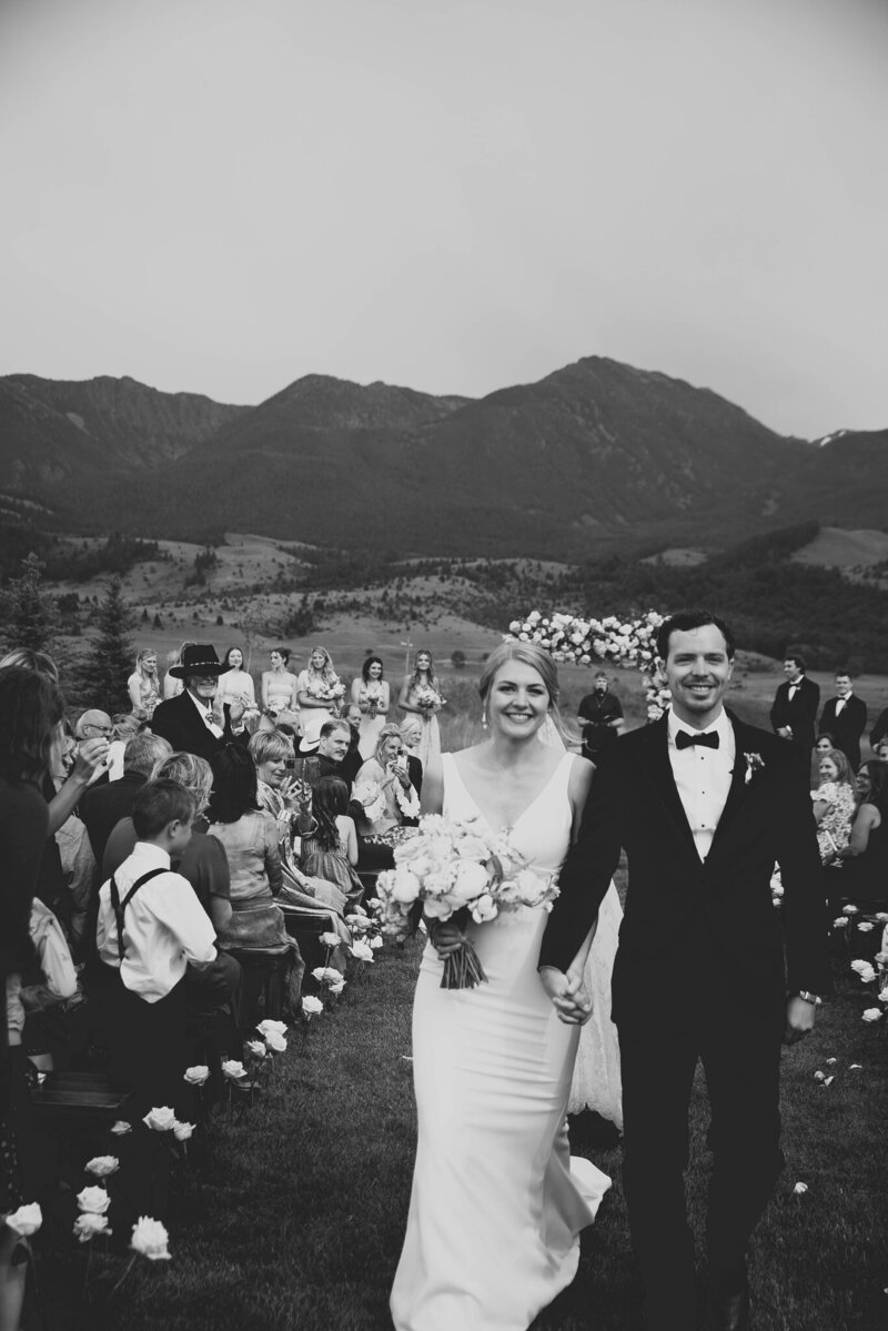 couple smiling and holding hands
