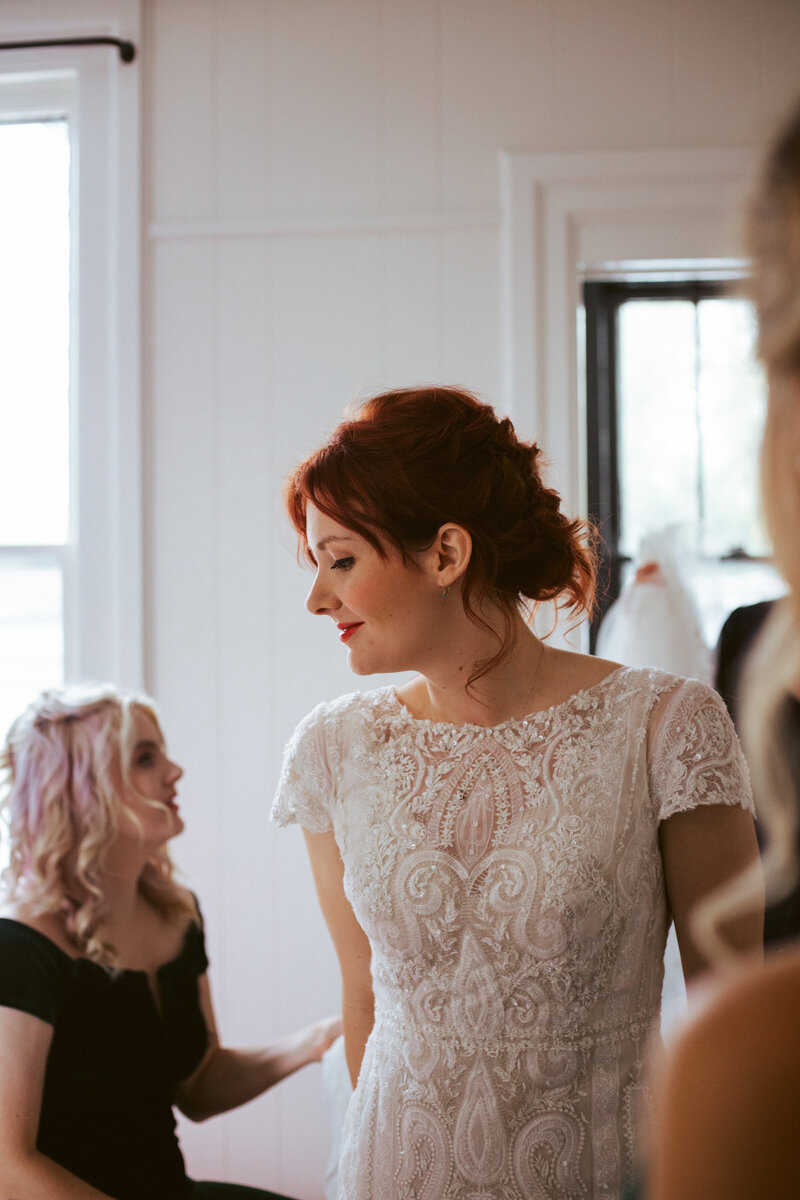 bride with red hair and white wedding dress