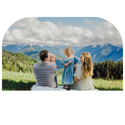 Picture of a family at Hurricane Ridge near Port Angeles Washington. View of the Olympic Mountain range in the background.
