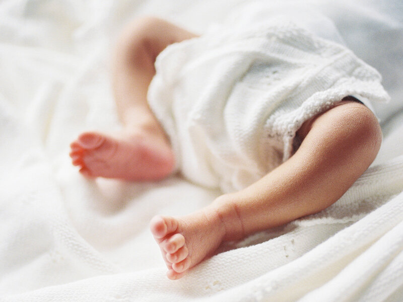A newborn's feet by Katie Stansfield Photography, a Richmond newborn photographer.