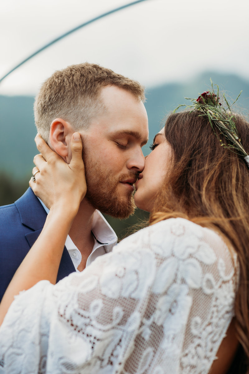 Eloped couple kiss after ceremony
