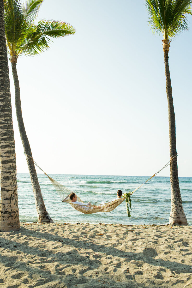groom and groom in hammock on maui beach