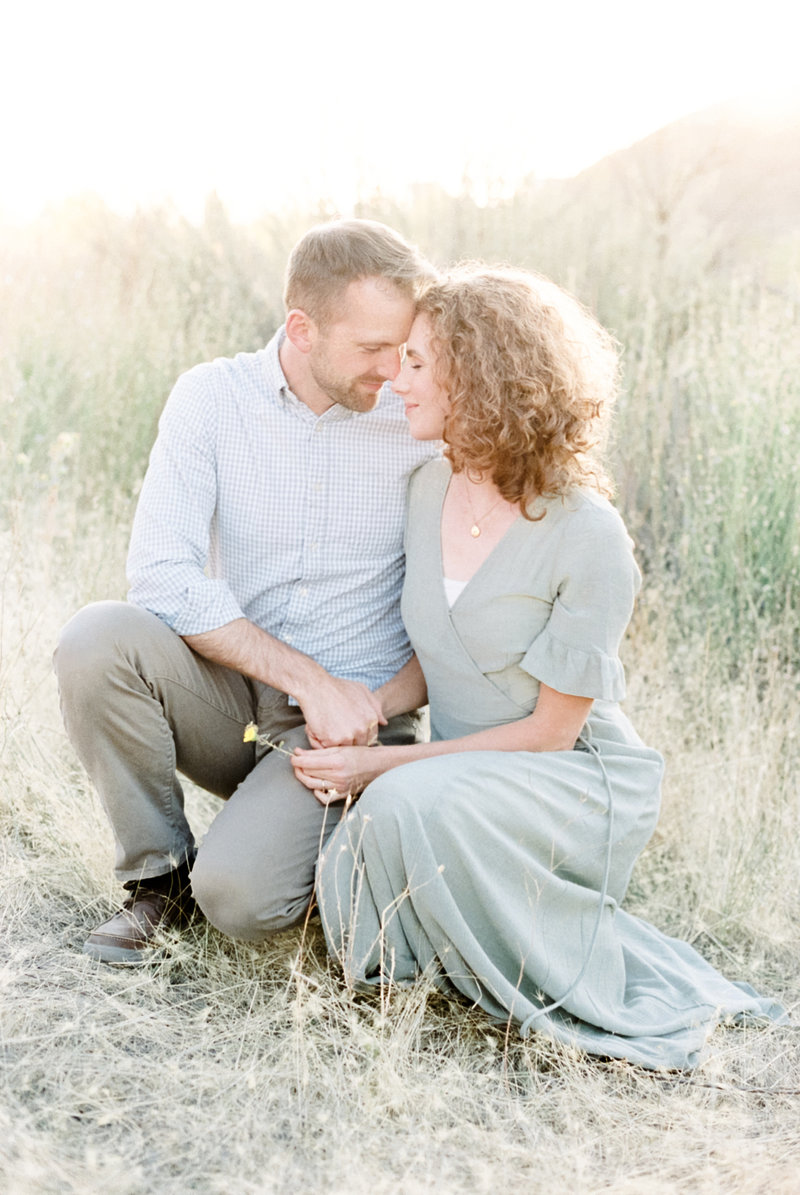 Couple kneeling Best McCall Wedding Photographers