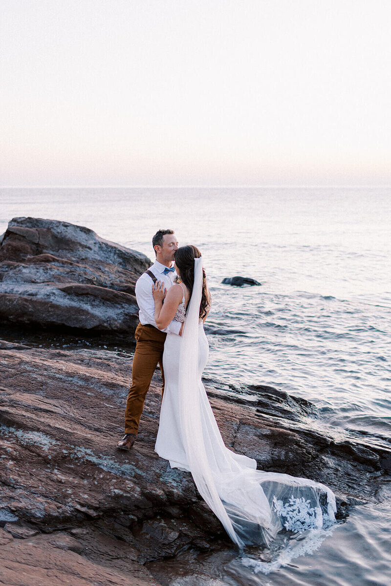 groom-kissing-bride-on-forehead