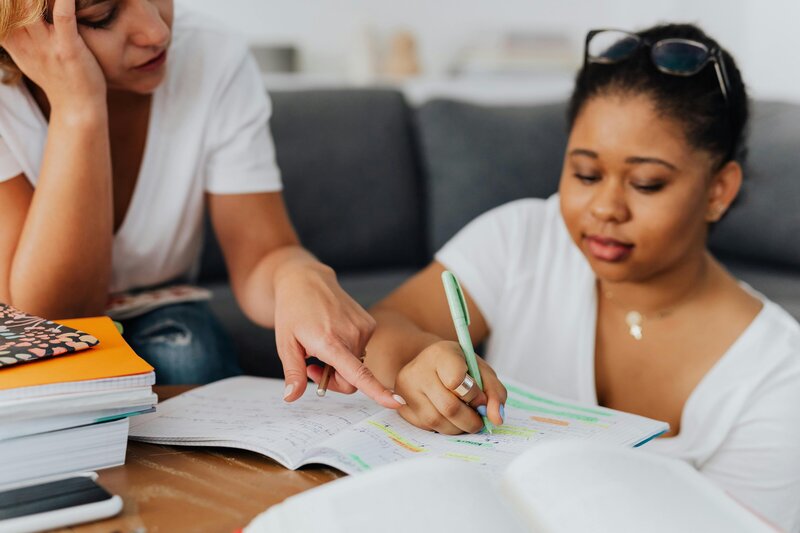 Student being coached by her mom