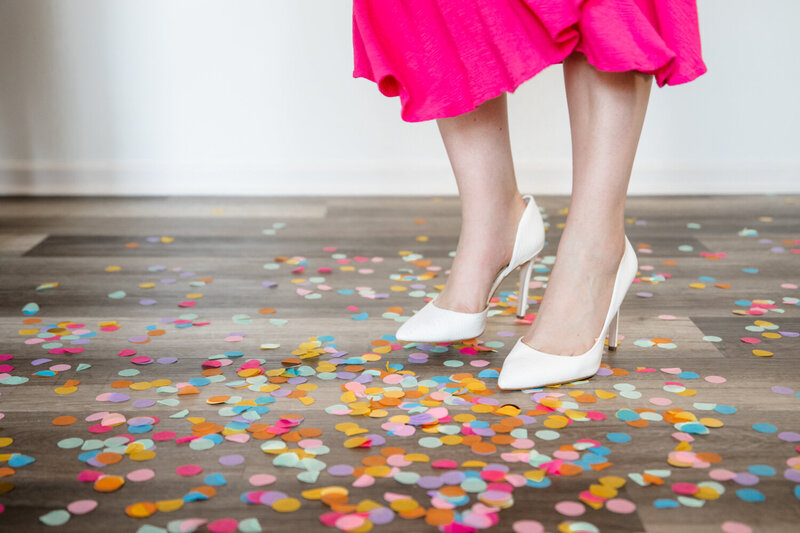 Personal stylist in Missouri wearing heels and standing on confetti