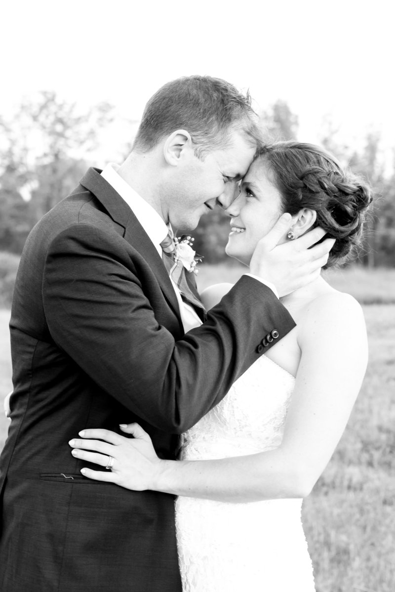 Bride and groom touch foreheads