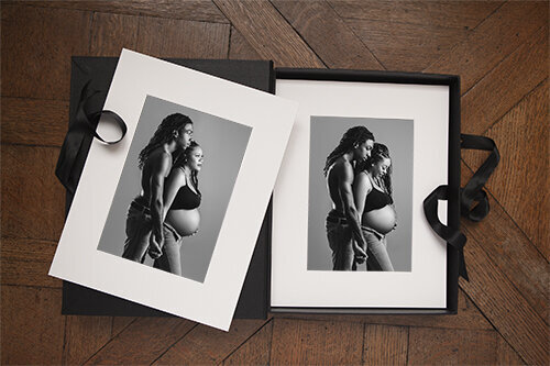 Folio box mockup shows multiple prints from one maternity session