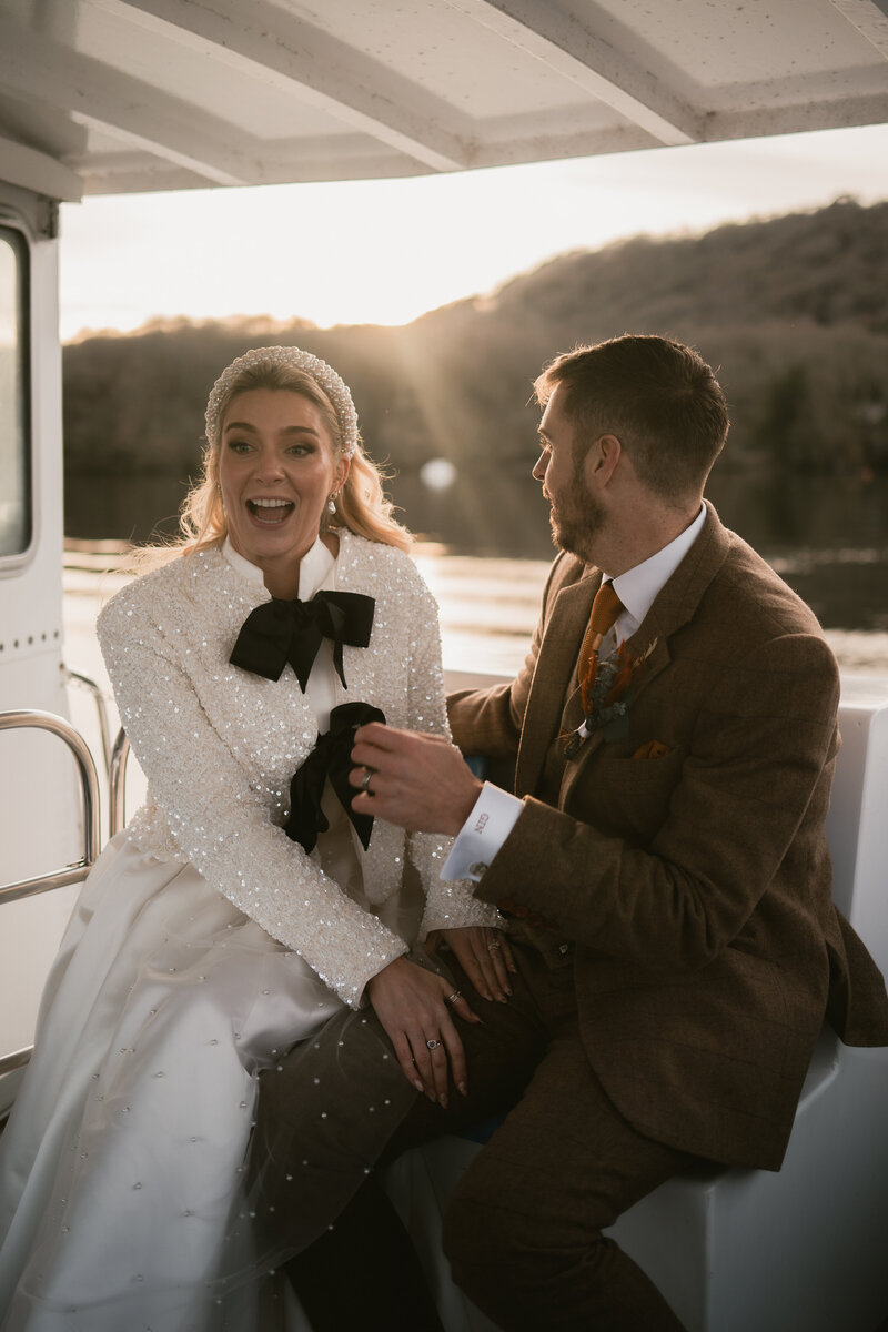 Cinematic photo of groom getting ready and looking out of the window