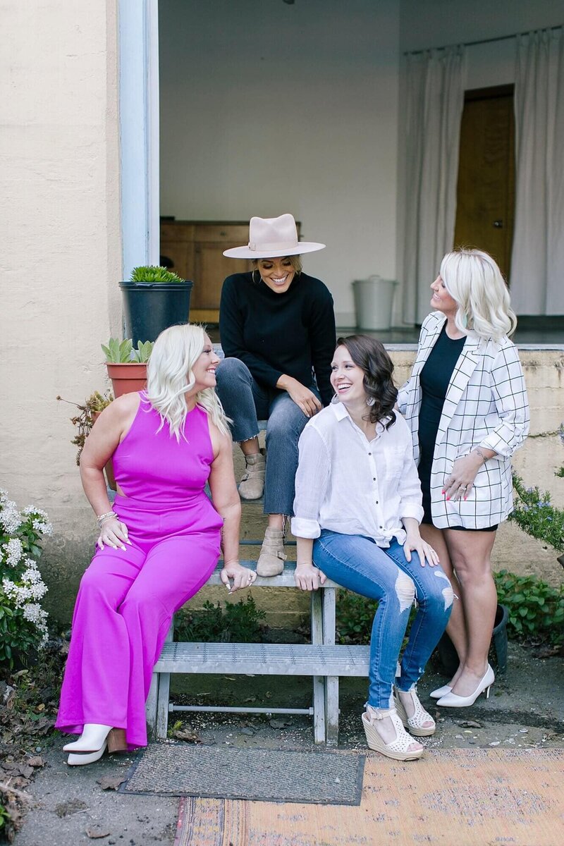 Caitlyn Gray sitting with  Jasmine Start and Hightway 3 for a business meeting