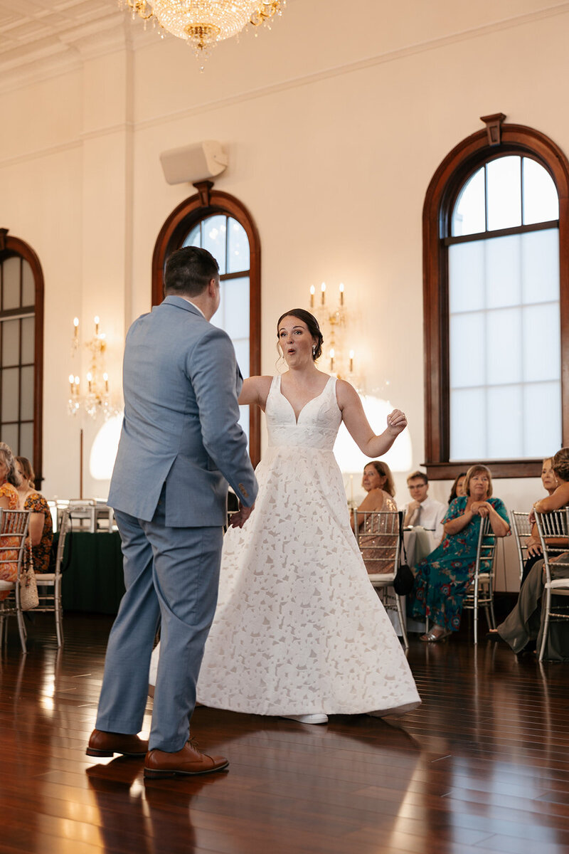 indie west photo portfolio image of bride and groom holding hands on wedding day