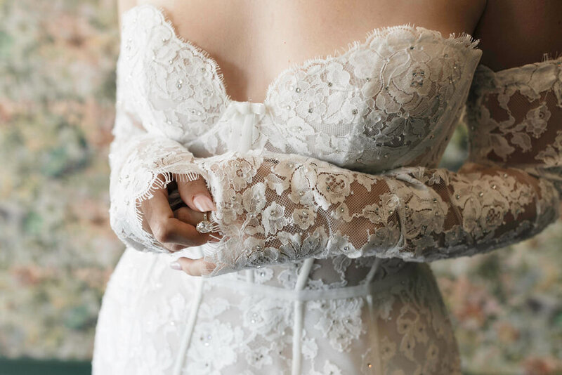 bride wearing floral lace wedding dress