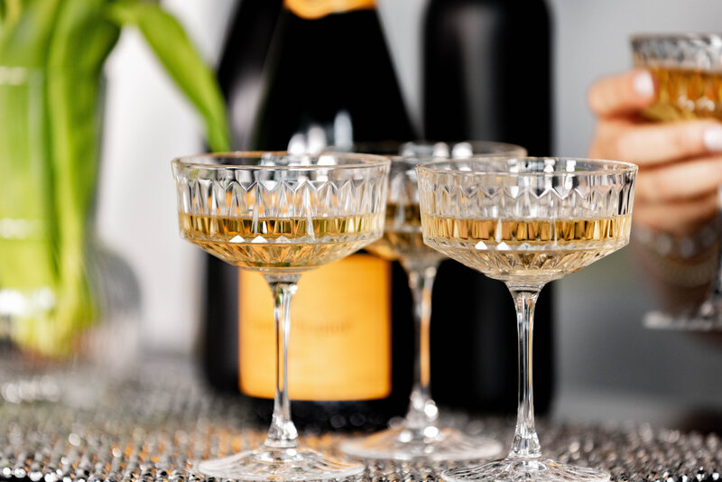 Champagne glasses filled at a DC event planning party