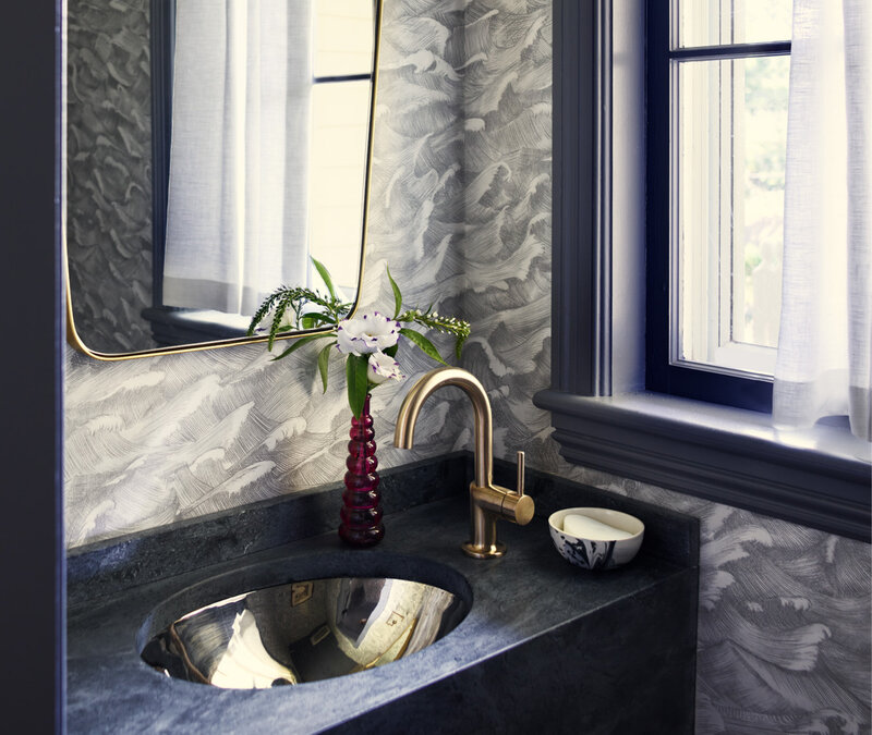 Historic homes designer renovates bathroom in Hingham home featuring a powder room with Cole and Sons wallpaper and custom detailing.