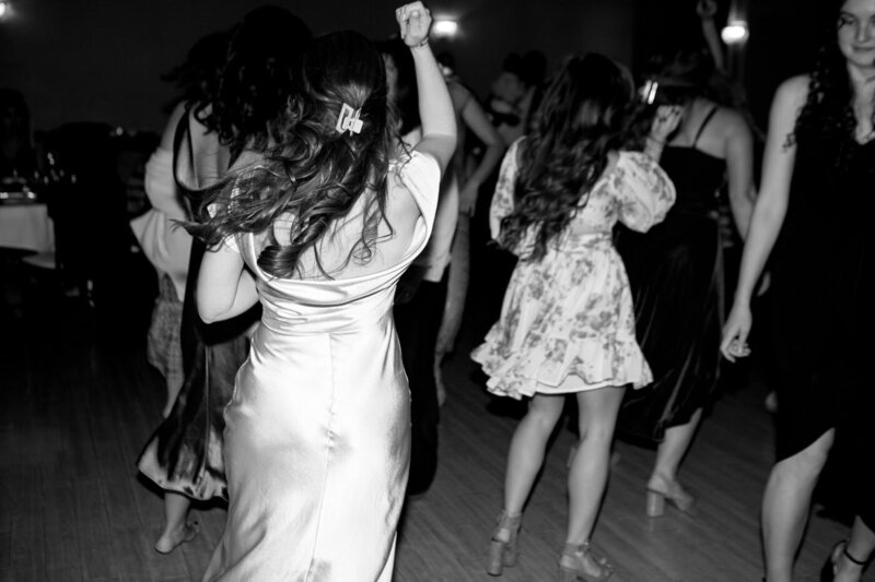 View from behind of ladies dancing at a wedding reception at Wedgewood at Black Forest, CO.