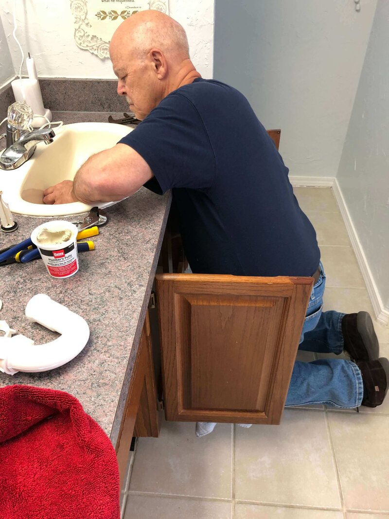 Jim Bartlett working on a sink