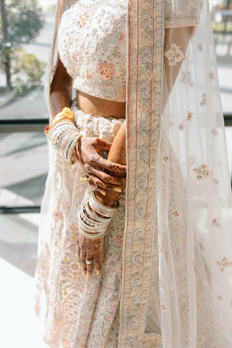 Indian wedding bride with lehenga and bangles