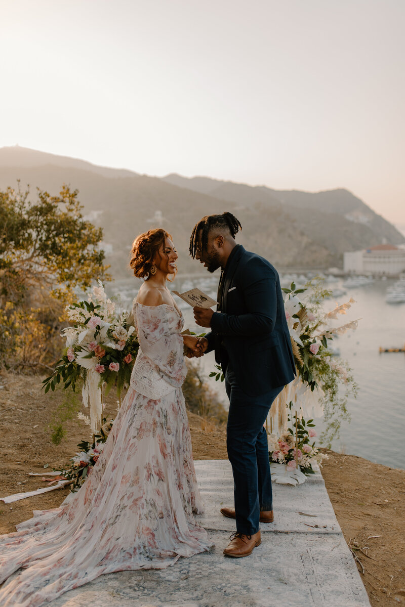 bride and groom walking on beach