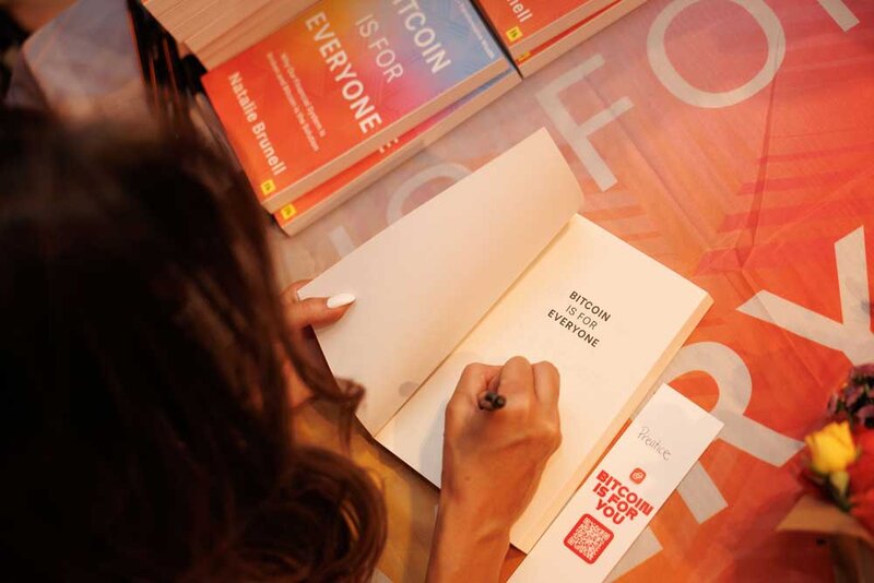 Natalie Brunell signing copies of Bitcoin is for Everyone