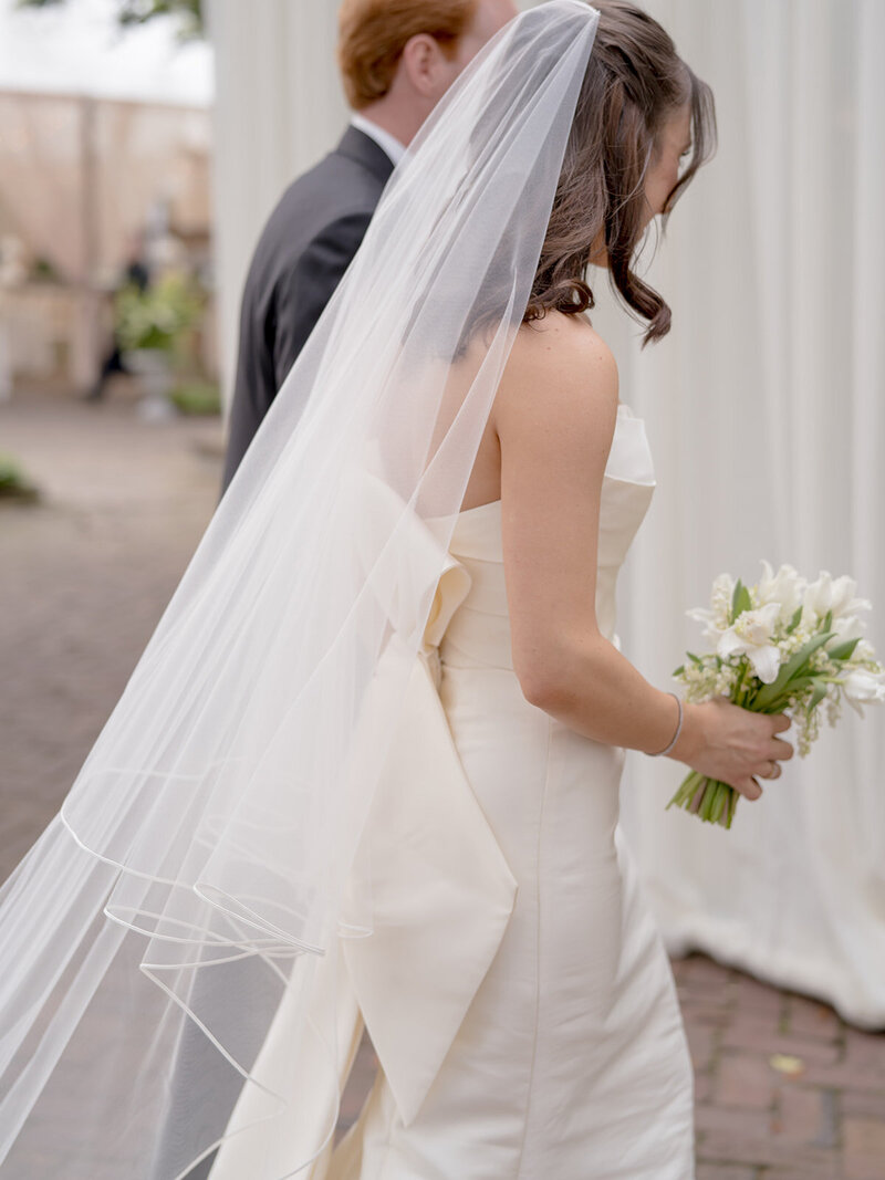 Bride and groom walk up memorial steps at their DC wedding