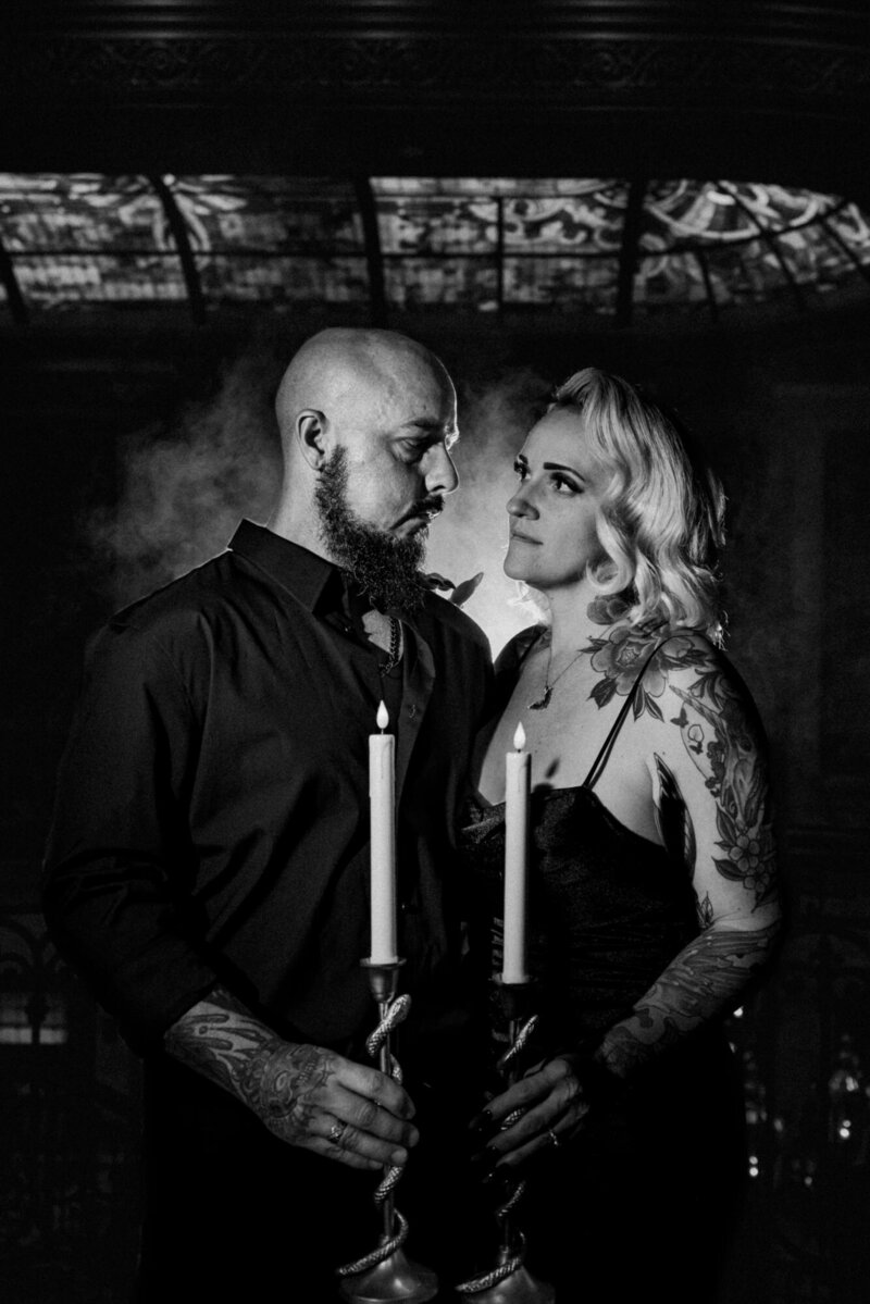 Black and White Portrait of gothic Couple holding candles with smoky background at the Cruz Building in Miami