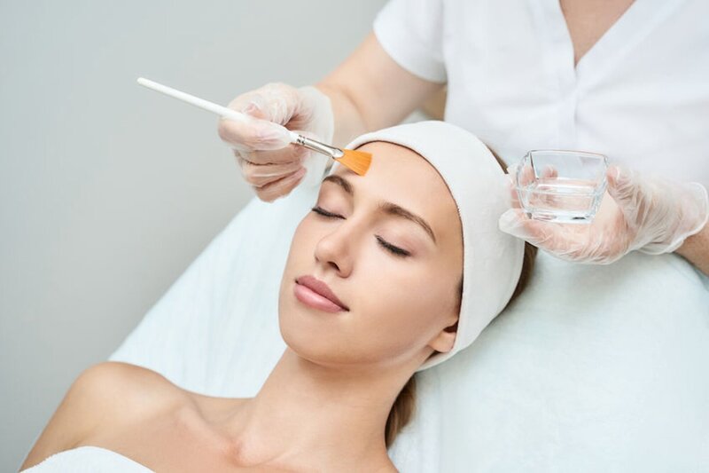 Woman having a face chemical peel