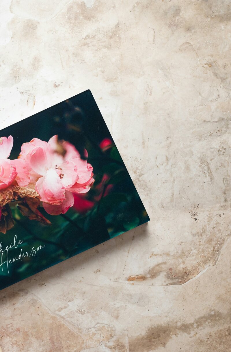 Personalized photo book cover with a rose bush on the front