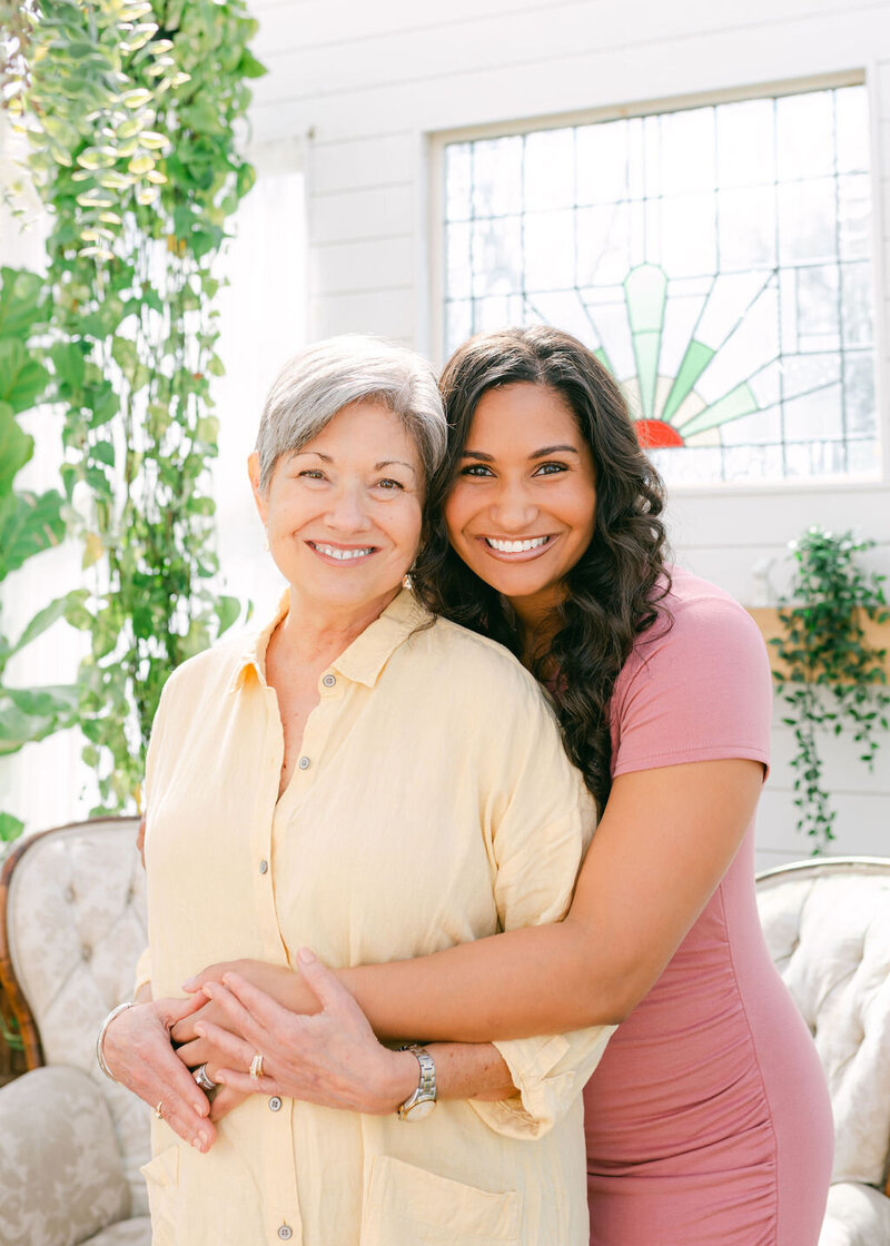 06-Candid-Family-Greenhouse-Portrait-Joyful-Hugs