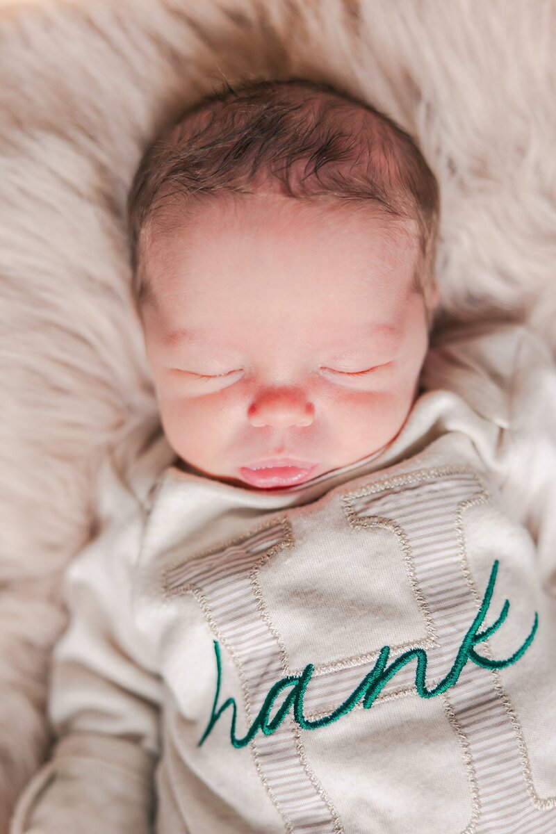 Sweet newborn peacefully sleeping during an in-home photography session in Charlottesville, VA