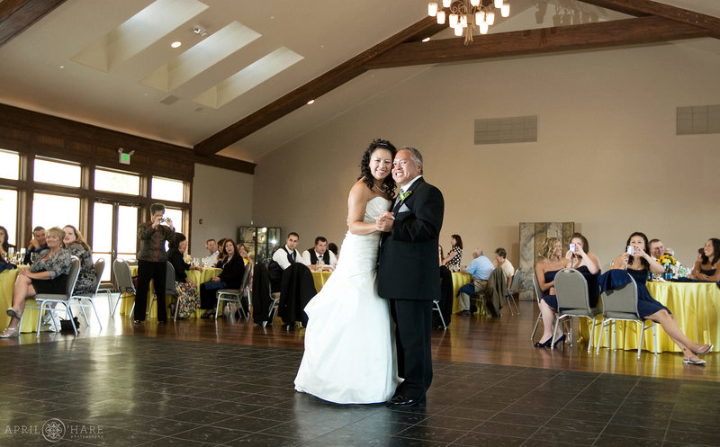 Father daughter dance inside the Pine Room at Cielo at Castle Pines with vaulted ceilings and skylights