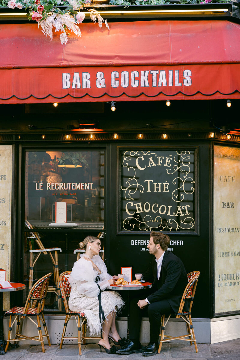 A wedding photo of the couple in the streets of Paris France