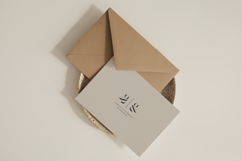Business card and envelope on display.