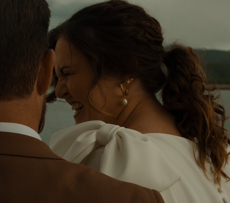 A couple laughing after their elopement in Rocky Mountain National Park.