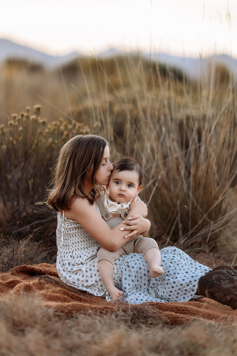 siblings snuggled up during their denver family photos