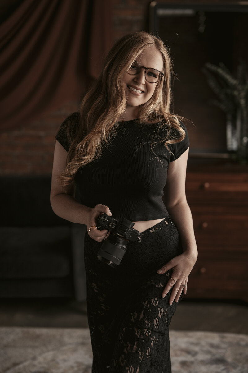 Friendly bio image of Maggie, the photographer and owner of The Delicate Studio Boudoir Photography