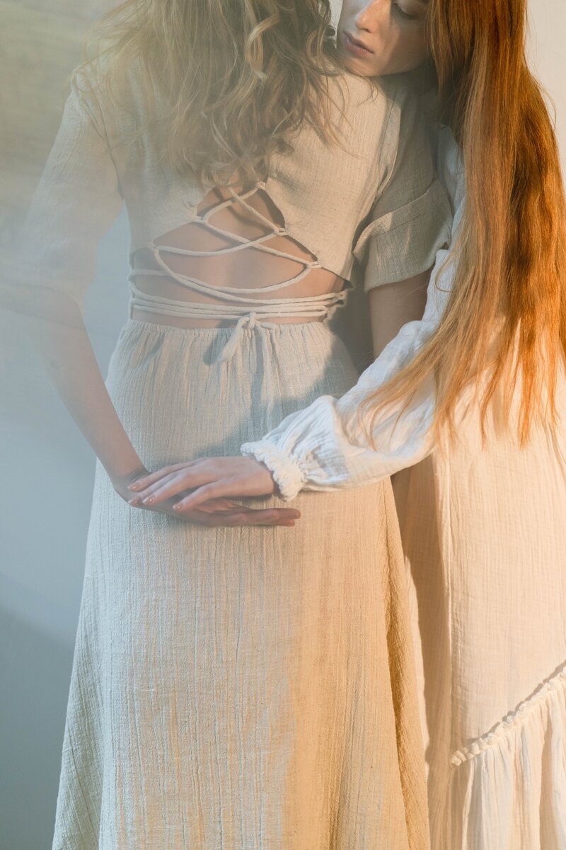 Woman holding another woman